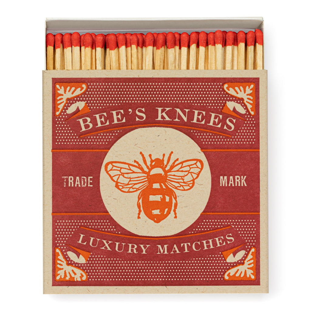 A matchbox with a bee on it.