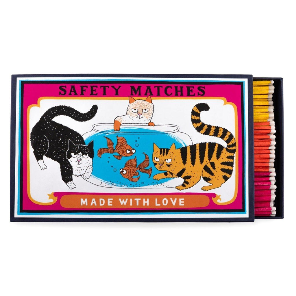 A decorative matchbox with three cats on it