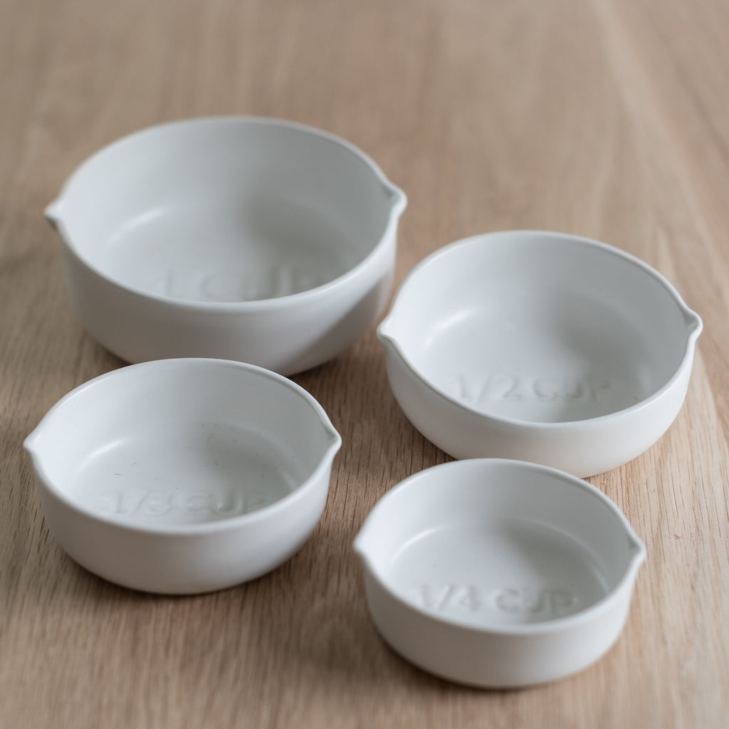 stoneware measuring cups - set of four nesting measuring cups - stoneware measuring cups - white measuring cups - be home - be home measuring cups
