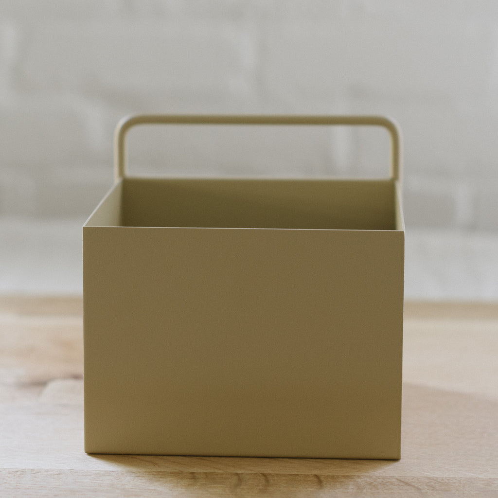 A tanish colored planter box