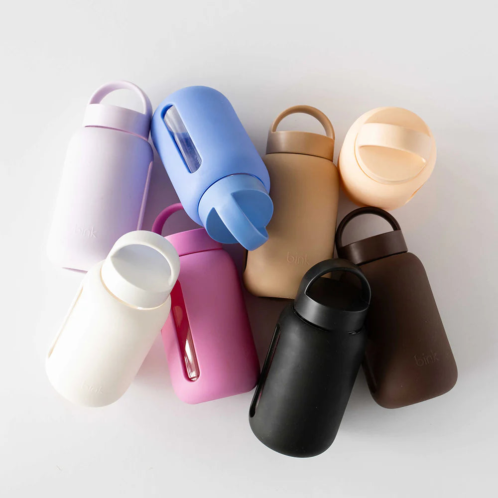 A collection of colorful Mini Glass Water Bottles