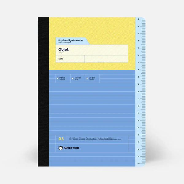 Notebook with yellow and blue cover on a white background
