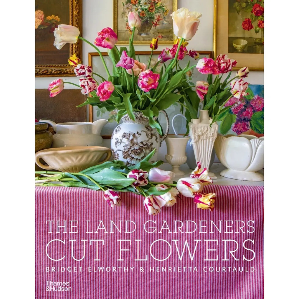 Book cover of 'The Land Gardeners Cut Flowers' with flowers and table setting on a pink background
