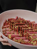 Bowl filled with red and green layered dessert