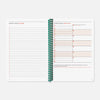 Pilot notebook with green spiral binding on a white background