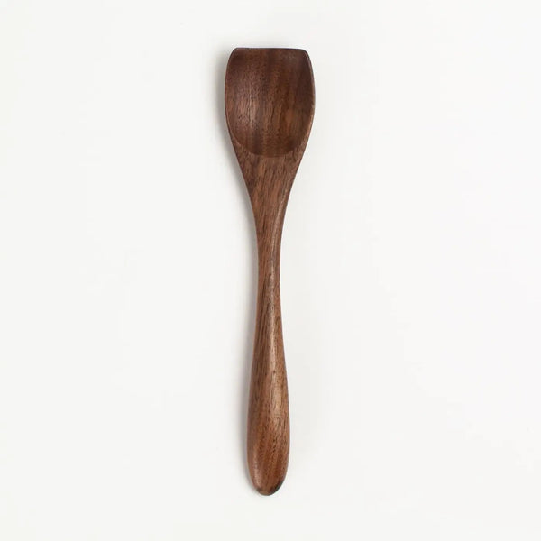 Wooden spoon on a white background