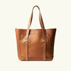 Brown leather tote bag on a white background