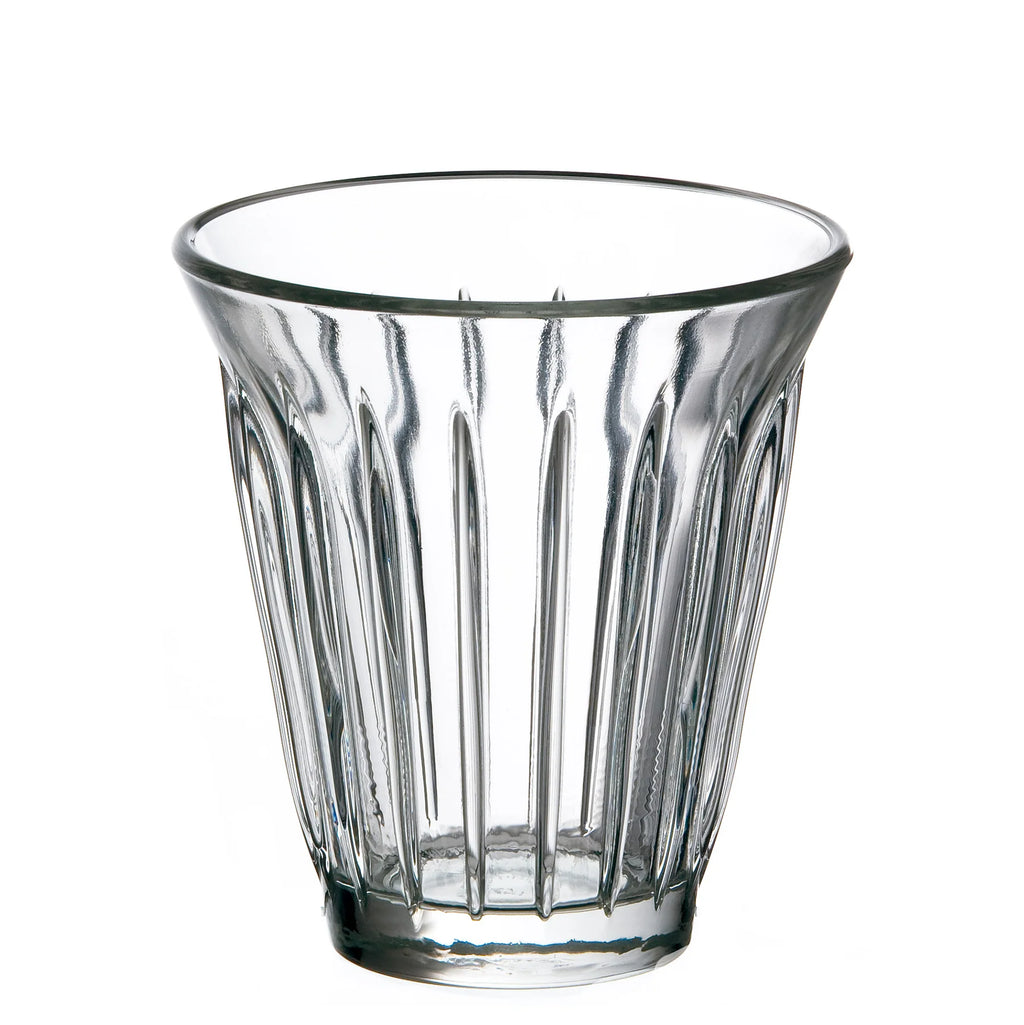Clear glass tumbler with vertical ridges on a white background