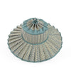 Decorative woven hat with a blue top on a white background