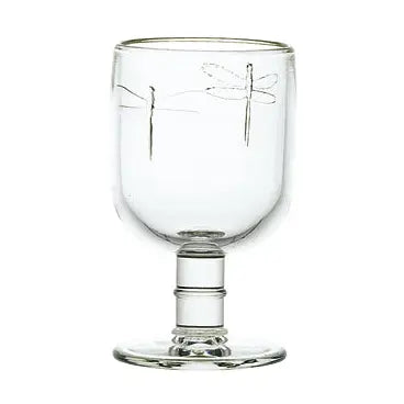 Clear glass goblet with dragonfly design on a white background