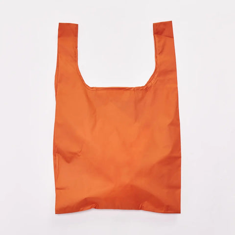 An orange reusable shopping bag with a wide top opening, shown flat against a plain white background.