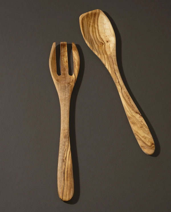 Wooden fork and spoon set on a dark background