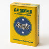 A yellow box of Aussie Playing Cards featuring a blue circular logo with the word 'Lingo' and white stars, photographed on a clean white background.
