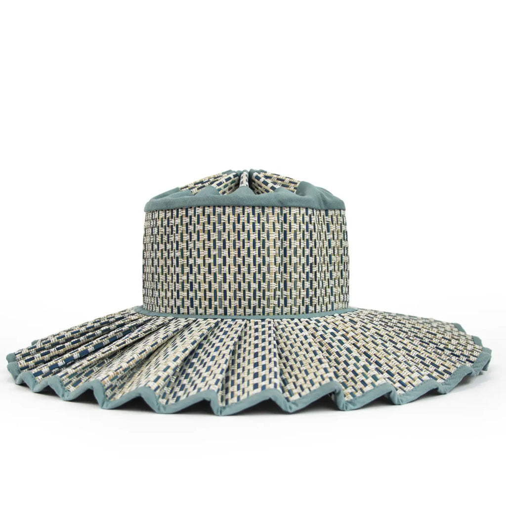 Woven sun hat with a wide brim on a white background