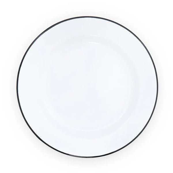 Round white plate with a black rim on a white background