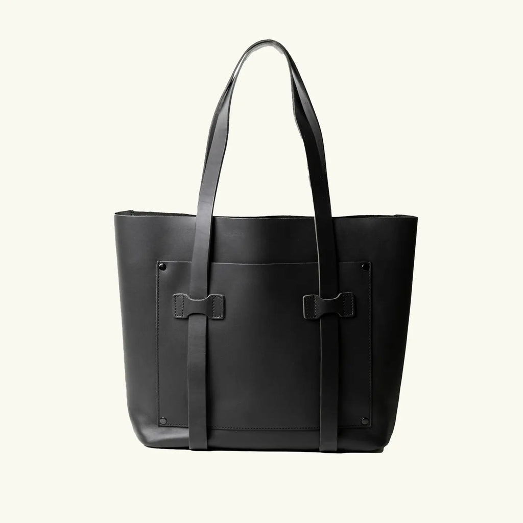 Black tote bag with shoulder straps on a white background