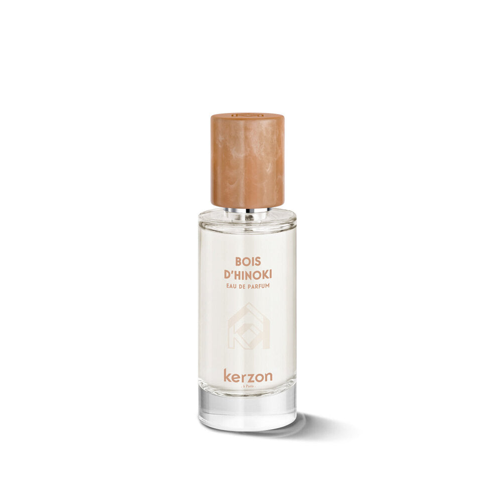 Perfume bottle with wooden cap on a white background