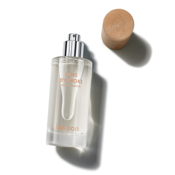 Perfume bottle with a brown cap on a white background