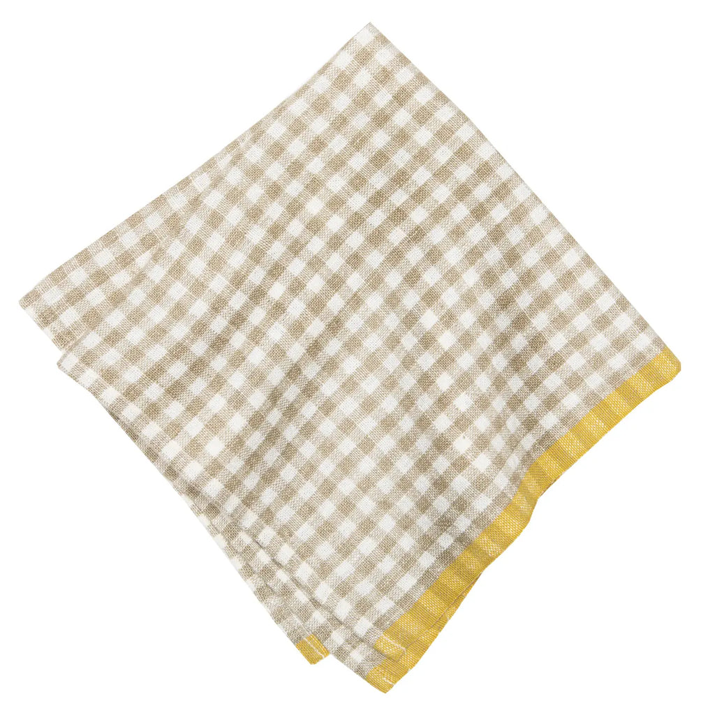 Checkered napkin with beige and white pattern on a white background