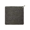 A square dark gray seat pad with a fringed edge and a small silver metal pull tab in the top right corner, shown on a plain white background.