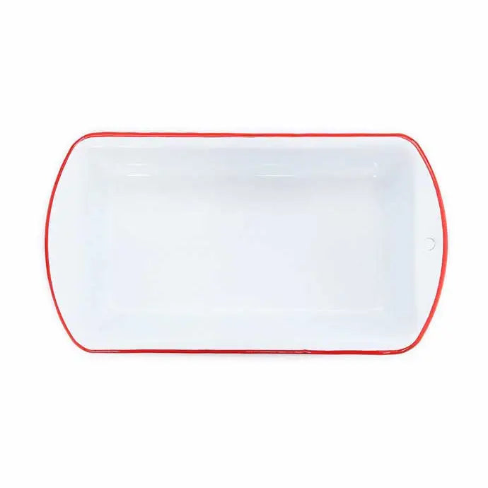 White enamel loaf pan with red rim on a white background seen from above