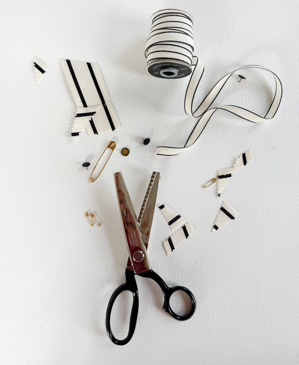 Scissors and decorative items on a white background