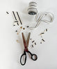 Scissors and decorative items on a white background