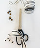 Scissors with a decorative bow on a white background