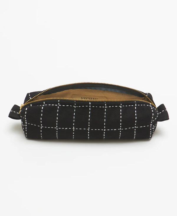 Black grid-patterned pouch with a gold zipper on a white background