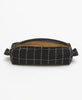 Black grid-patterned pouch with a gold zipper on a white background