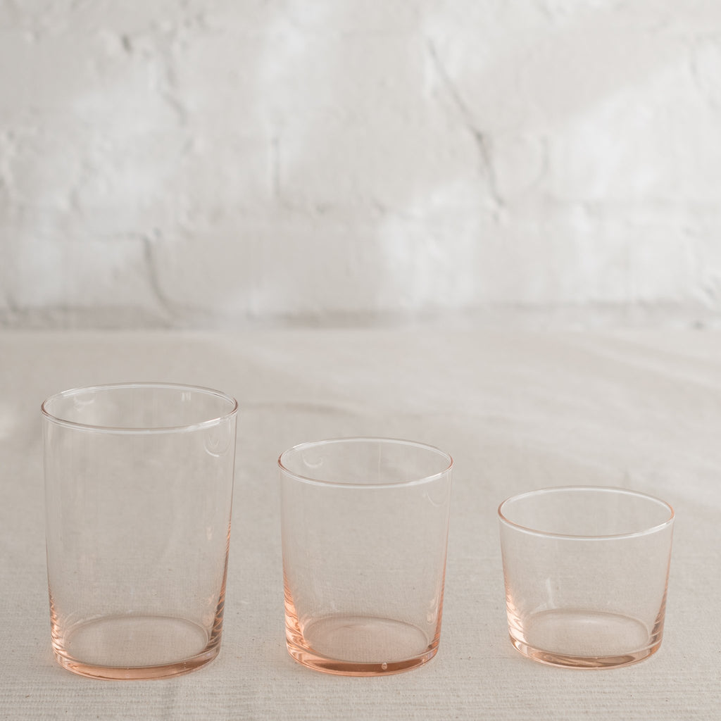 Clean lined glass tumbler in three sizes and available in multiple colors.
