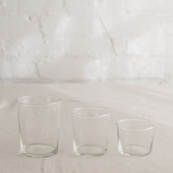 Clean lined glass tumbler in three sizes and available in multiple colors.