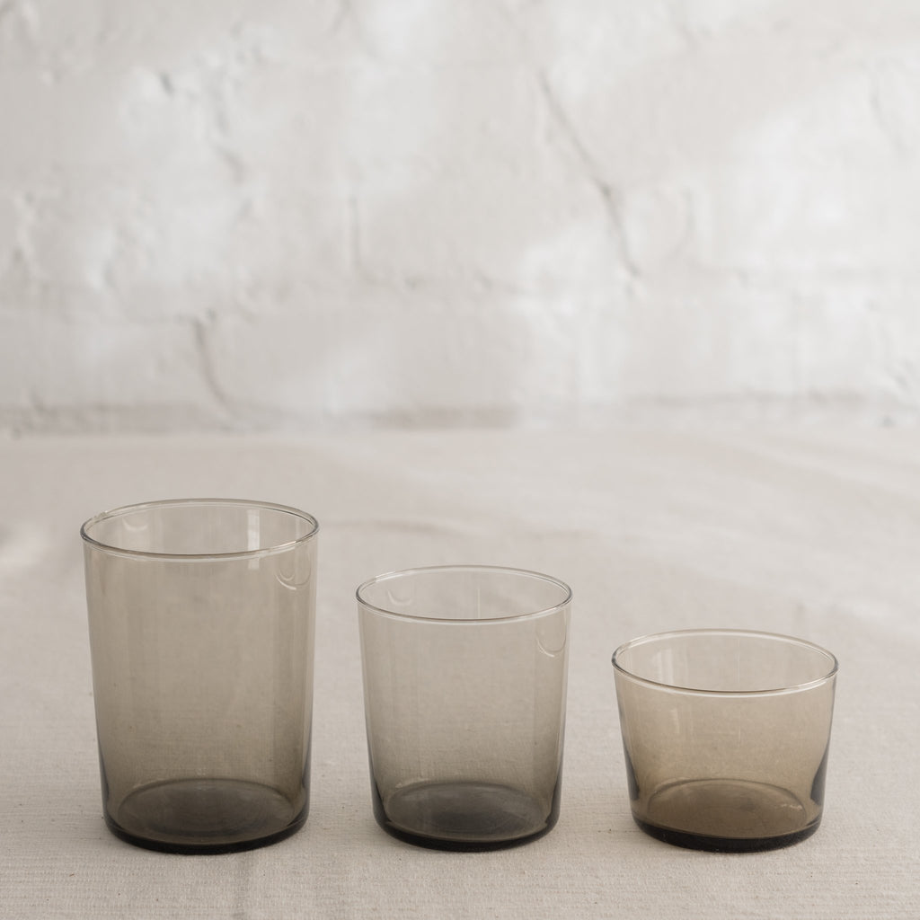 Clean lined glass tumbler in three sizes and available in multiple colors.